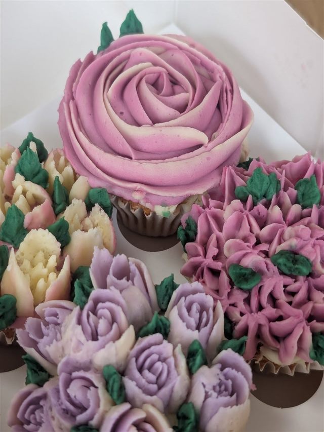 Freshly decorated cupcakes with buttercream